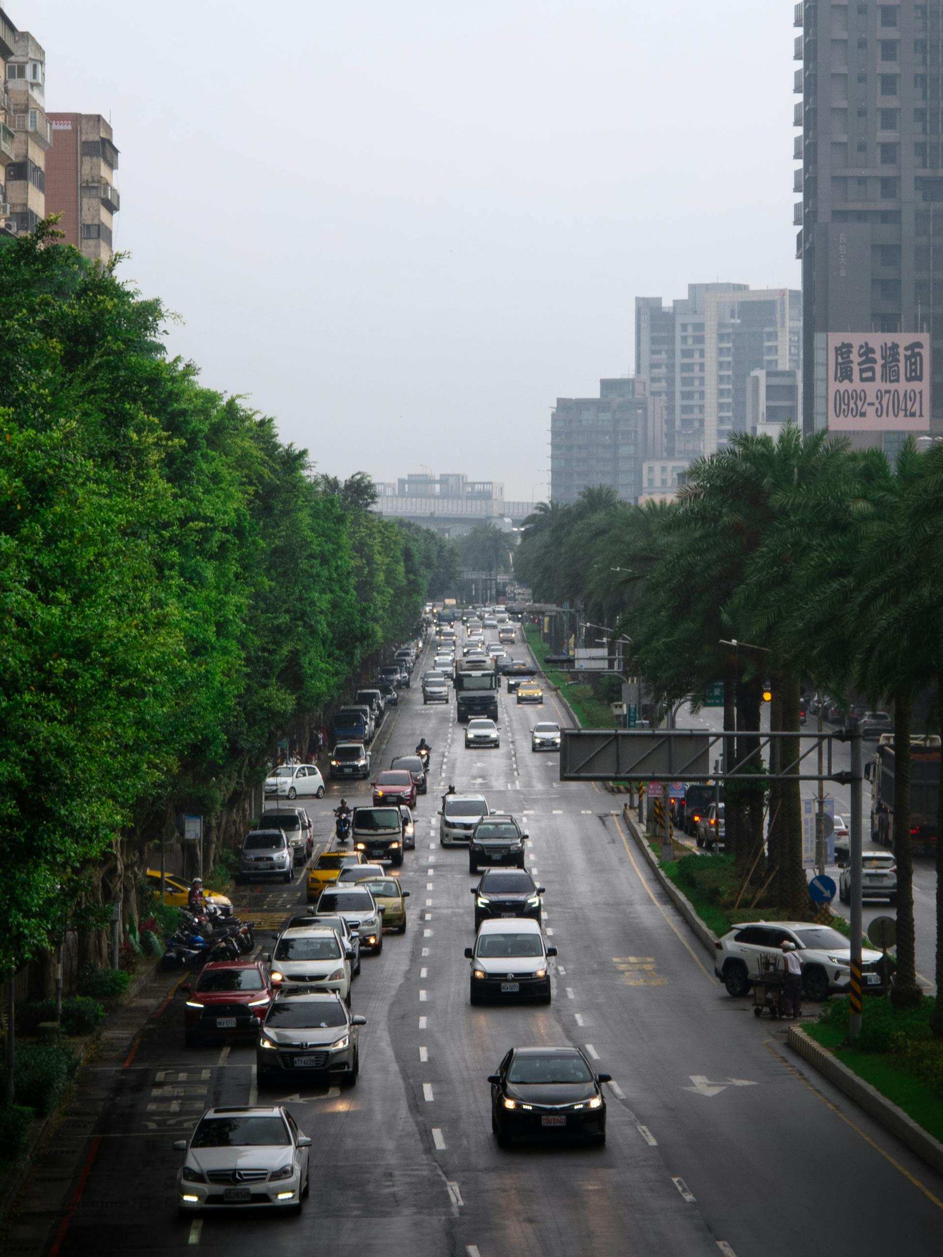 Explore the dynamic rush hour traffic on a bustling street in New Taipei City, Taiwan.